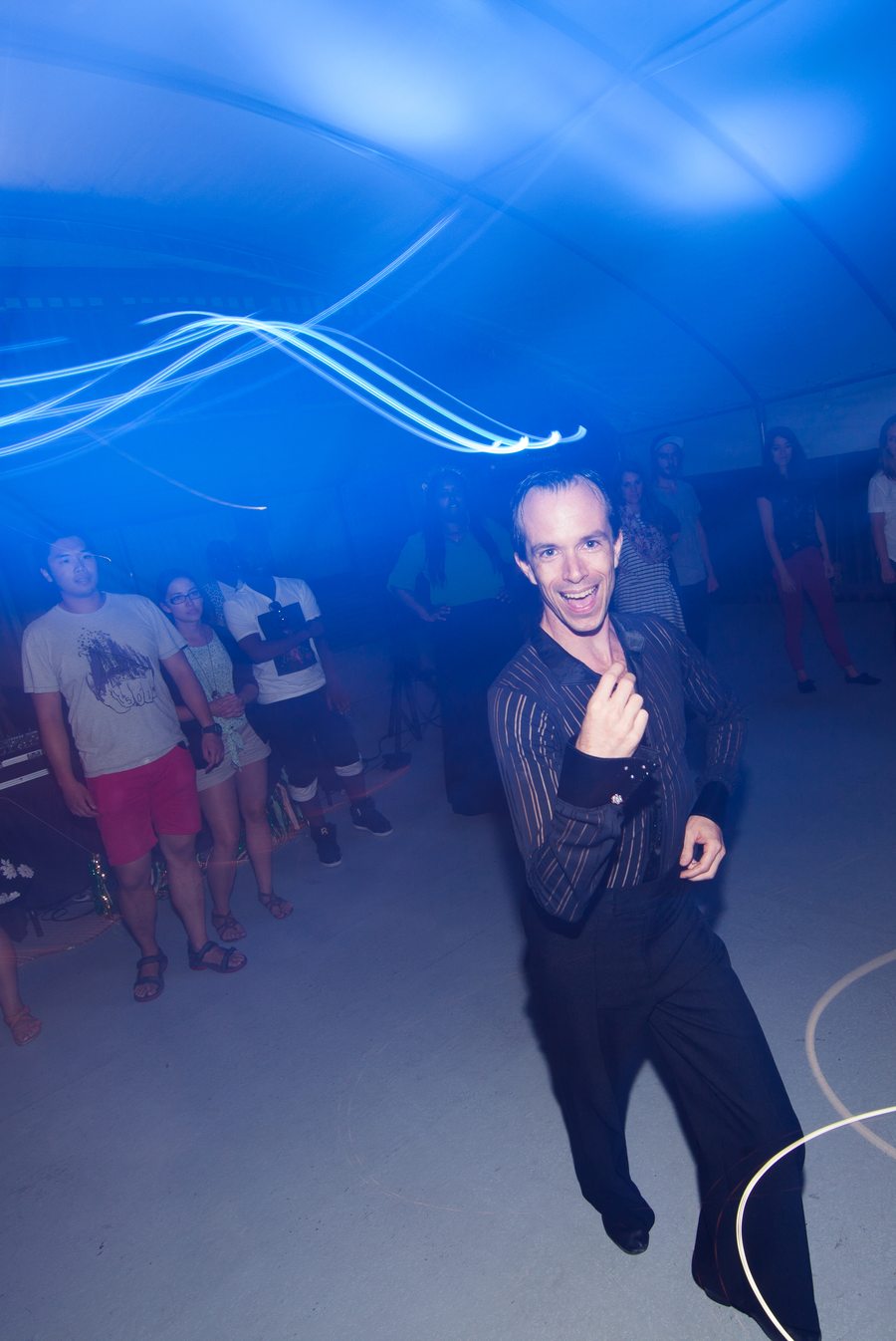 A dancer moving at a social dance event