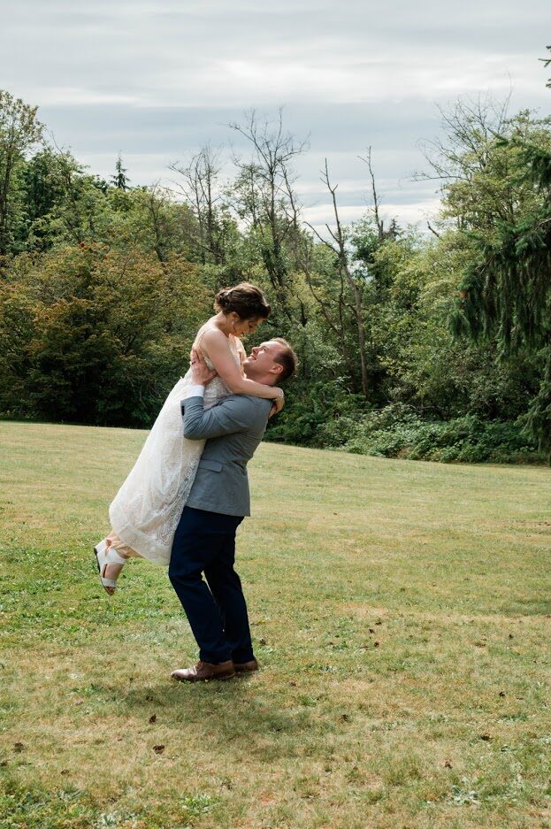 Wedding couple dancing outdoors