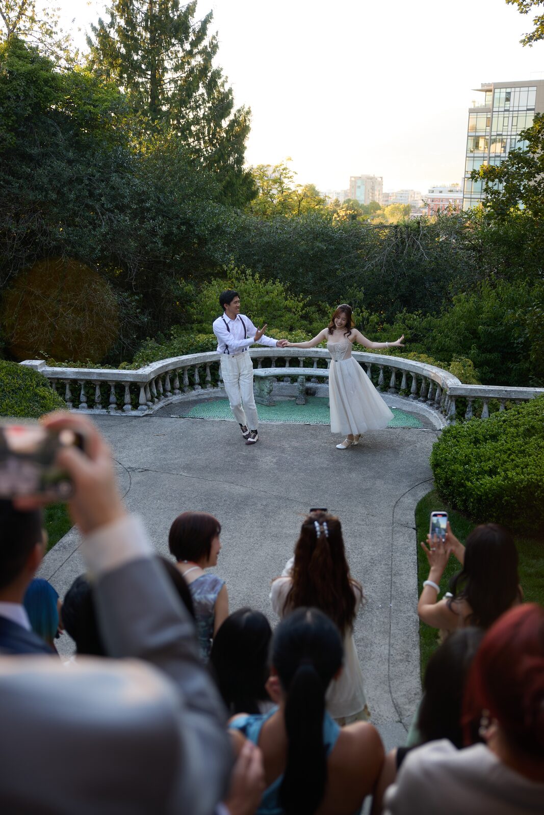 Wedding couple dancing in a garden setting