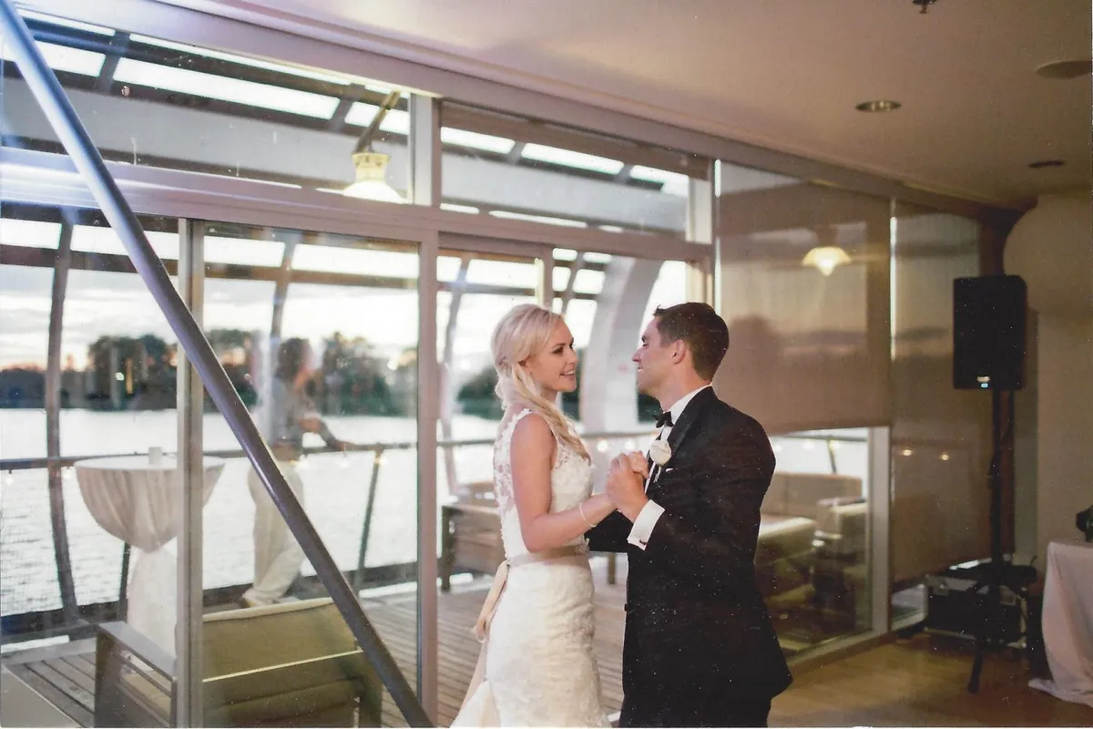 A couple dancing together at their wedding reception