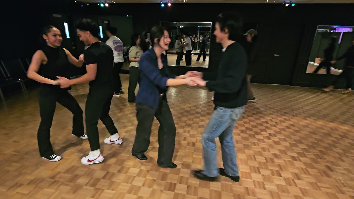 Couples dancing together at a social event