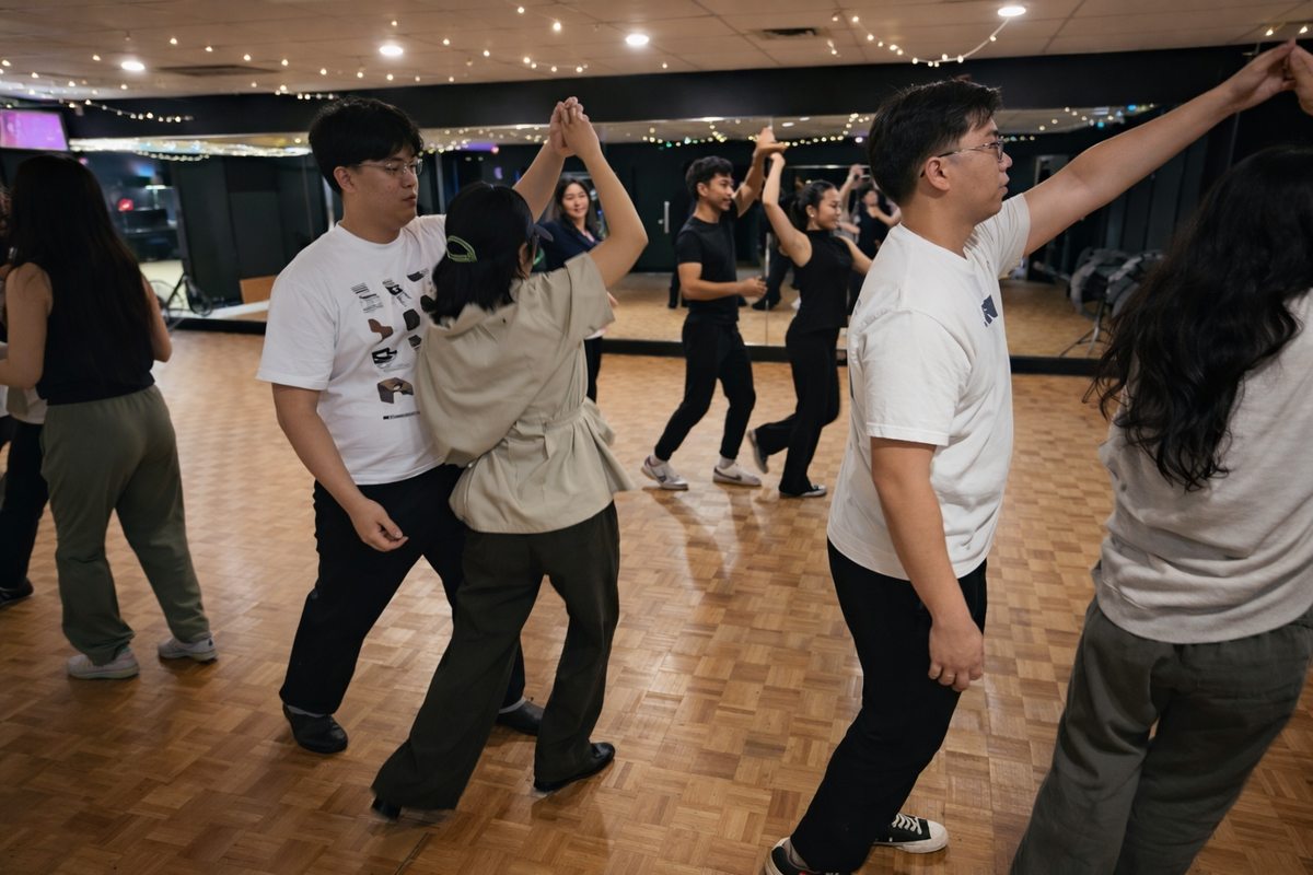 Couples practicing underarm turns together
